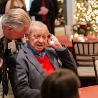 J.C. Huizinga speaking to other reception guest